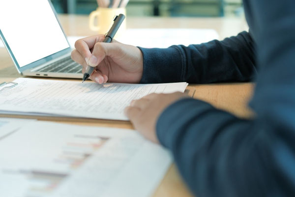 Filling out applications for the Alcohol Beverage Control Department for a liquor license.